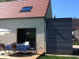 une maison ossature bois vêtue d'un enduit à la chaux (vignette 1)